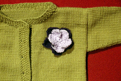 Debbie Bliss Jacket With Moss Stitch Bands - do you like the flower?