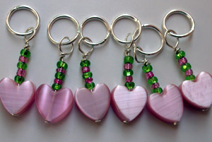 Pink and green heart stitch markers